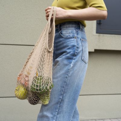 side-view-woman-carrying-groceries-tote-bag